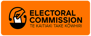 The Electoral Commission logo, including the words 'Electoral Commission' and in smaller text 'Te Kaitiaki Take Kōwhiri' and a stylised hand placing a vote in a ballot box. The design uses orange, black and white colours to represent an official electoral authority.